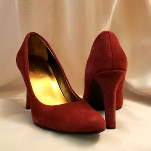 Red suede pumps